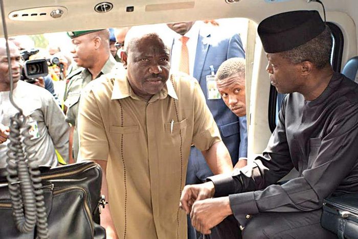 Acting President, Prof Yemi Osinbajo discussing with Rivers State Governor Nyesom Wike at the Port Harcourt International Airport