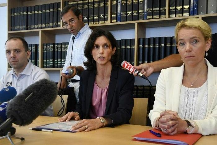 Lorient's prosecutor Laureline Peyrefitte (C) gives a press conference along with vice-prosecutor Cecile Flamet (R) and police chief Jonathan Rey (L) on July 13, 2017 in Lorient, western France, after three human foetuses were discovered