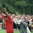 Tiger Woods raises his arms in victory after winning the 1997 Masters tournament, a turning point for the sport, the man and even the course