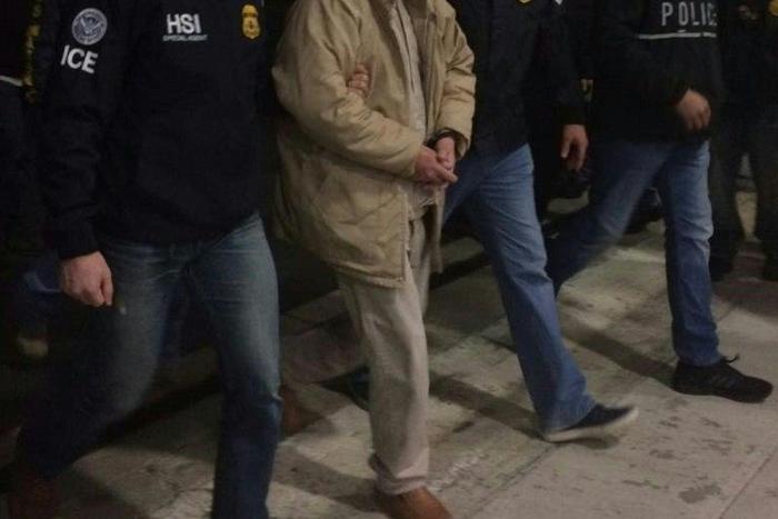 Joaquin Guzman aka "El Chapo" is escorted by Immigration and Customs Enforcement personal as he is extradited to the United States on January 19, 2017, in Ciudad Juarez, Mexico