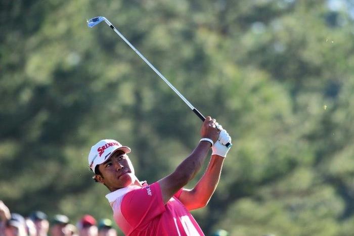 Hideki Matsuyama of Japan plays his shot from the 12th tee at Augusta National Golf Club on April 4, 2017