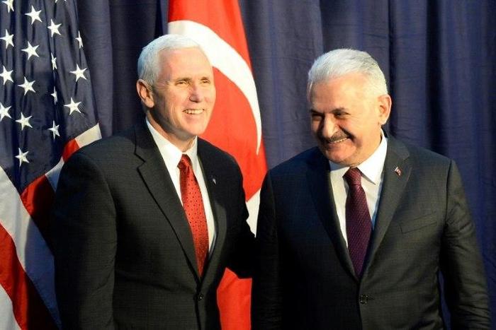 US Vice President Michael Richard Pence (L) and Turkish Prime Minister Binali Yildirim pose for photographers ahead talks at the Munich Security Conference
