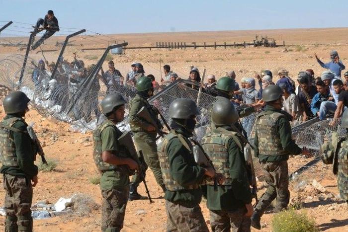 Tunisian protesters confront security forces outside the El Kamour oil and gas pumping station on May 22, 2017