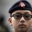 Cadets from the Hong Kong Adventure Corps wear green camouflage and berets and learn everything from map-reading to abseiling