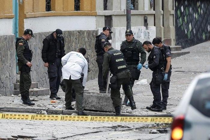 Colombian anti-explosive police inspect the site where a bomb exploded near the La Santamaria bullring in downtown Bogota, Colombia, on February 19, 2017