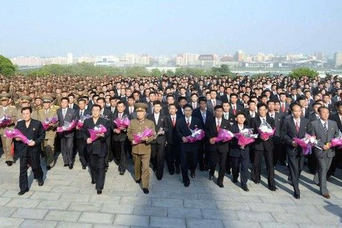 This picture released by North Korea's official Korean Central News Agency (KCNA) on May 19, 2017 shows developers of the strategic ballistic rocket Hwasong-12 visiting the statues of former leaders in Pyongyang