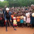 Ex-Governor, Adams Oshiomhole, his wife, Lara and the Co-ordinator of International Christian Centre, Solomon Folorunsho with some children at the IDP Camp in Edo State.