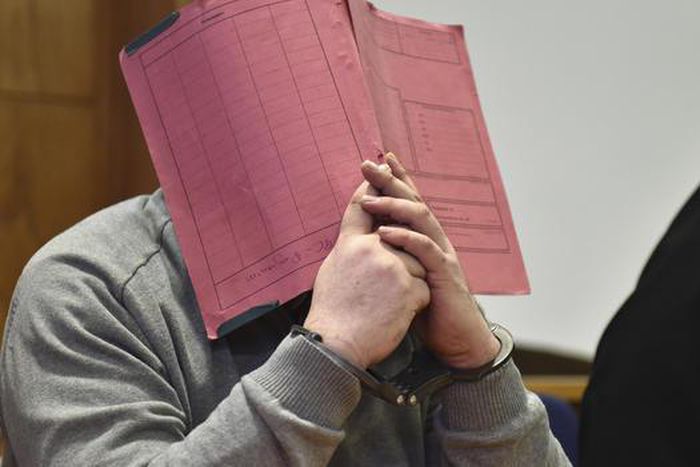 Niels Hoegel covering his face