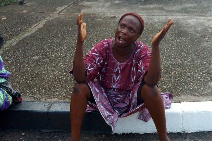 A parent of one of the kidnapped students of Lagos Model College Igbonla, protesting at Alausa