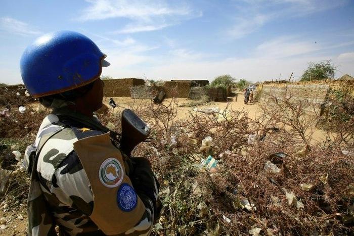 A member of the peacekeeper troops stands guard at a UN refugee camp in the city of Nyala, in South Darfur, on January 9, 2017