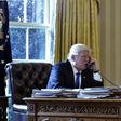 US President Donald Trump speaks on the phone with Russia's President Vladimir Putin from the Oval Office of the White House on January 28, 2017