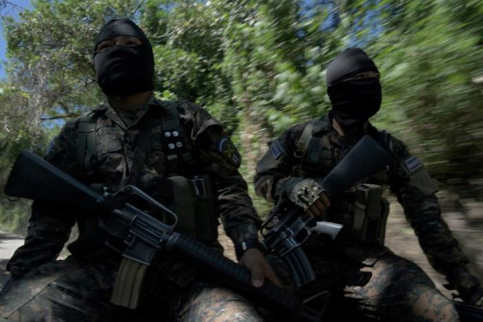 Soldiers patrol in search of gang members around the municipalities of San Martin and San Jose Guayabal, in El Salvador