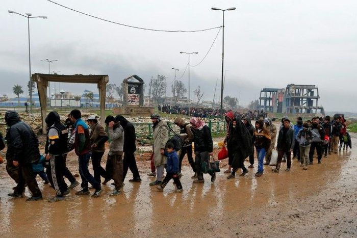 Families fleeing the fighting in Mosul, northern Iraq pictured on March 23, 2017