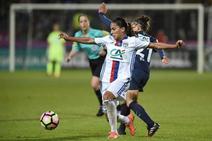 Lyon's Amel Majri (L) vies with Paris Saint-Germain's Veronica Boquete during the women's French Cup football finale match on May 19, 2017
