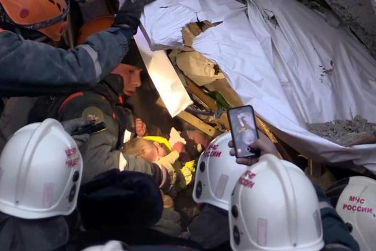 A baby was among five people rescued from the rubble