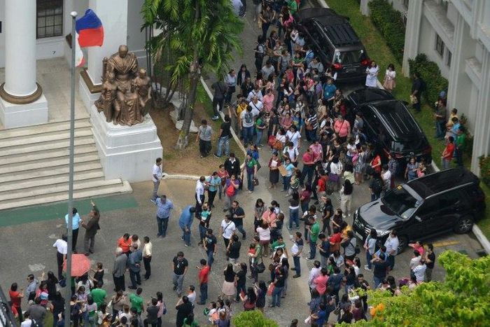 Buildings in central Manila were evacuated Friday after a strong 6.2 magnitude earthquake rocked the region south of the capital