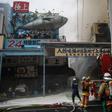 Japanese firefighters try to extinguish a fire at Tokyo's Tsukiji fish market on August 3, 2017
