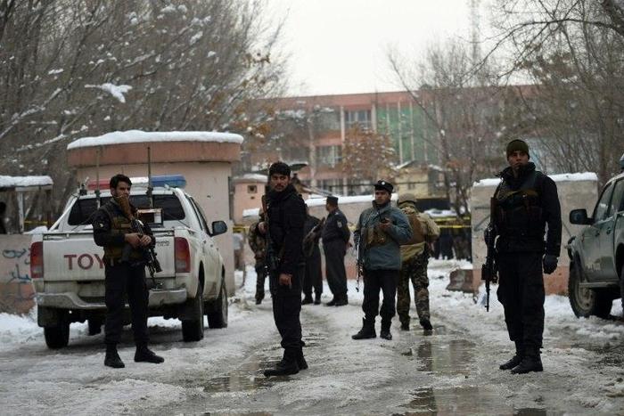 Afghan security personnel stand guard at the site of a suicide blast near the Afghan Supreme Court in Kabul on February 7, 2017