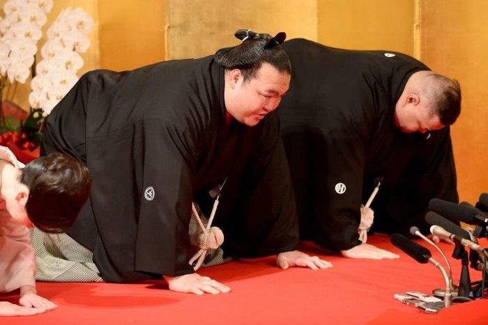 Accompanied by stable master Tagonoura (R) and Tagonoura's wife, sumo wrestler Kisenosato meets with representatives from the Japan Sumo Association, in Tokyo, on January 25, 2017