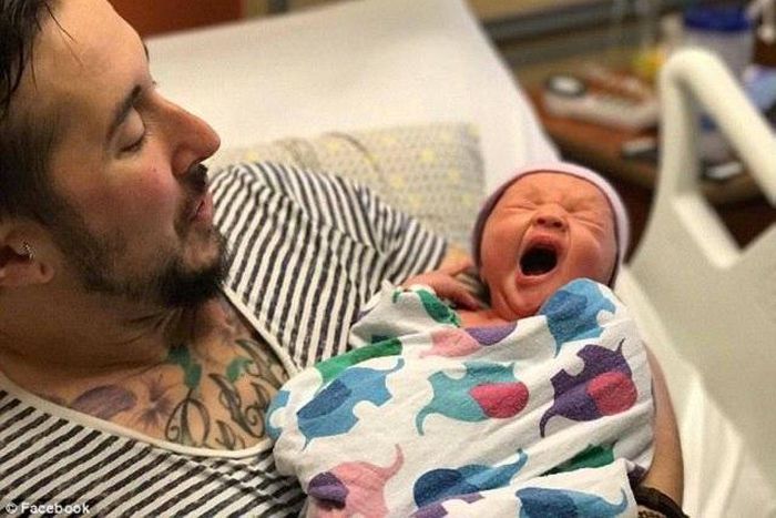 A proud Trystan Reese and his new baby