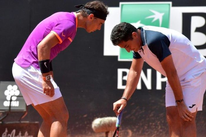 Rafael Nadal (left) talks with Nicolas Almagro during their Rome Masters match on May 17, 2017