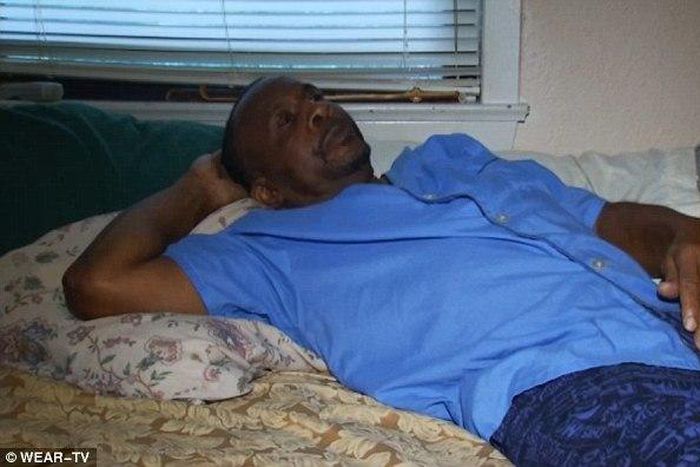 A man lying on a bed