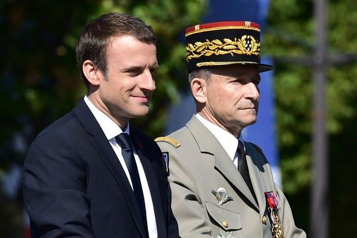 French President Emmanuel Macron (left) and General Pierre de Villiers take part in the annual Bastille Day parade on the Champs-Elysees avenue in Paris, on July 14, 2017