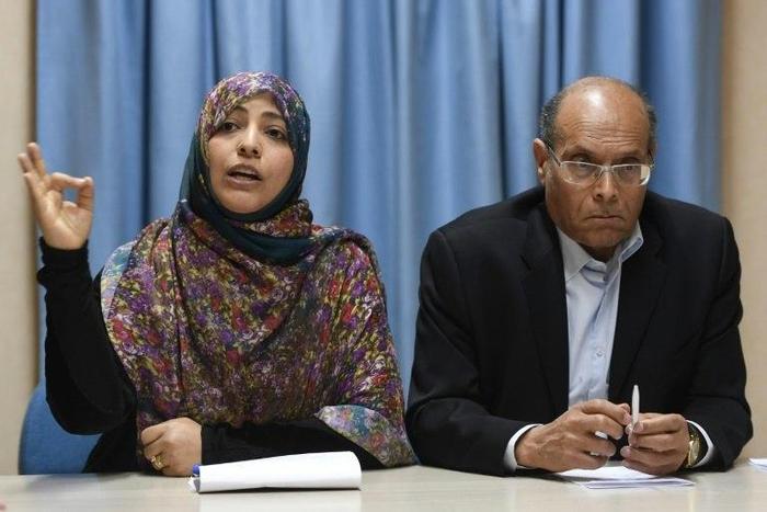Yemeni journalist and Nobel Peace Prize laureate Tawakkol Karman speaks next to former interim Tunisian president Moncef Marzouki (R) in Geneva on March 2, 2017
