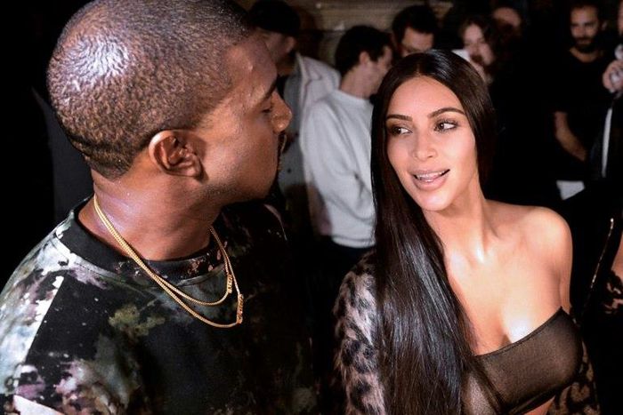 Kanye West and Kim Kardashian (right) pictured at a Paris fashion show on September 29, 2016