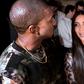 Kanye West and Kim Kardashian (right) pictured at a Paris fashion show on September 29, 2016