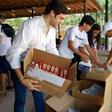 Alfred Santamaria packs medical supplies to send to protesters in Venezuela at the "Solidaridad Venezuela" event in Hialeah, Florida on May 13, 2017