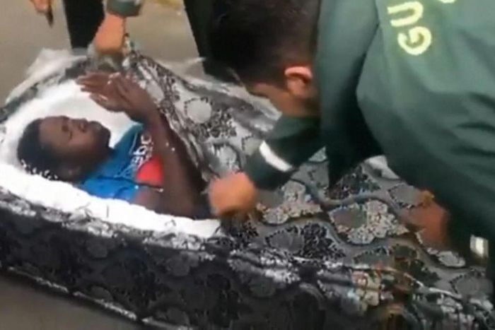 After the top of a mattress is cut open, an African migrant is discovered in the first documented attempt to smuggle a person into Spain using a bed.