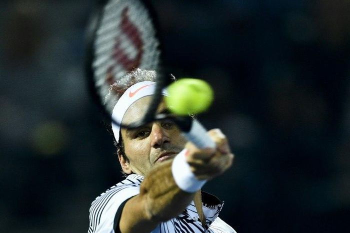 Roger Federer of Switzerland returns the ball to Russia's Evgeny Donskoy on March 1, 2017, in Dubai