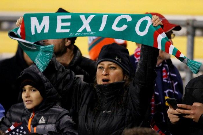 Mexico soccer fans cheer during the second half of a 2018 FIFA World Cup qualifying match between the Mexico men's national team and the US men's national team in Columbus, Ohio on November 11, 2016