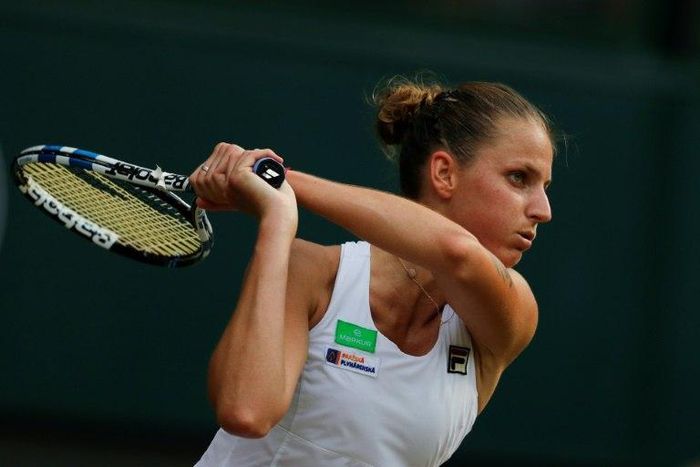 Czech Republic's Karolina Pliskova returns against Slovakia Magdalena Rybarikova during their women's singles second round match on the fourth day of the 2017 Wimbledon Championships July 6, 2017