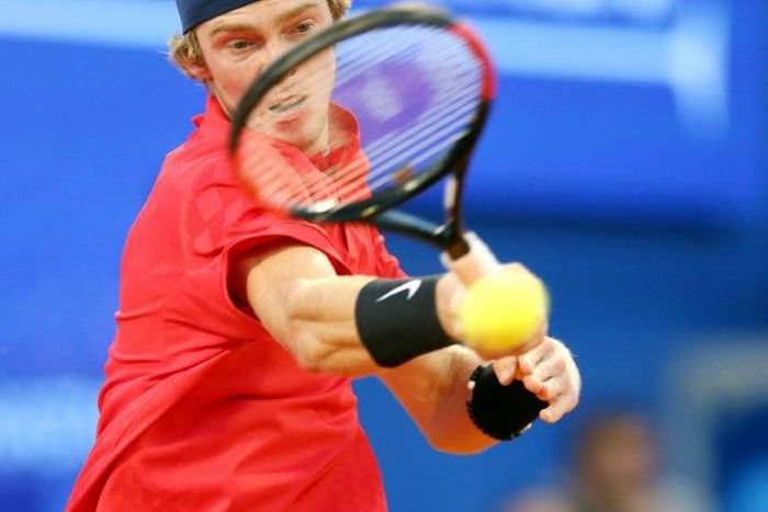 Russia's Andrey Rublev returns the ball on July 23, 2017