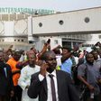 People wait for relatives at Nnamdi Azikiwe International Airport in Abuja, Nigeria