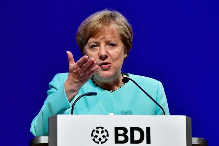 German Chancellor Angela Merkel makes an overture to new French President Emmanuel Macron by saying she is open to considering his ideas to reform the eurozone