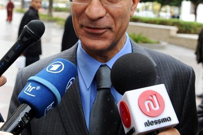 Tunisian then-Defence Minister Ridha Grira speaks to the press upon arrival to attend the first ministers session, on January 20, 2011 in the government palace in Tunis