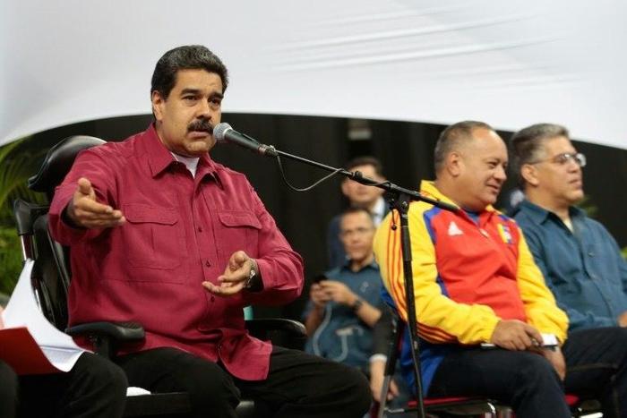 Venezuelan President Nicolas Maduro (L), shown in Caracas this week in this picture handed out by his office, rescheduled the inauguration of his controversial Constituent Assembly for Friday