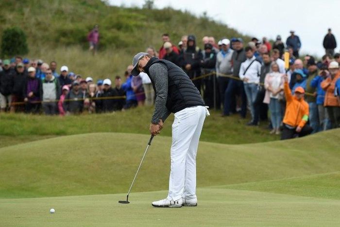 US golfer Jordan Spieth putts on the 3rd green during his opening round 65 on the first day of the Open Golf Championship at Royal Birkdale, on July 20, 2017
