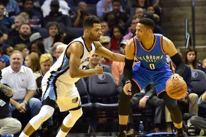 Russell Westbrook of the Oklahoma City Thunder dribbles past Andrew Harrison of the Memphis Grizzlies on April 5, 2017 in Memphis, Tennessee