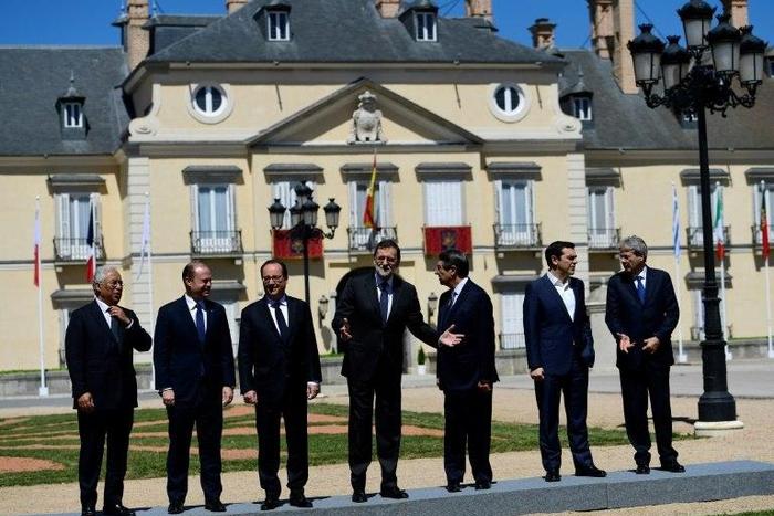Spanish Prime Minister Mariano Rajoy (centre) marshalls his fellow southern European leaders into posing for a group photo at the Palacio del Pardo, near Madrid, on April 10, 2017