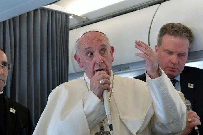 Pope Francis addresses reporters during his flight back to Rome following a two-day visit at Fatima in Portugal