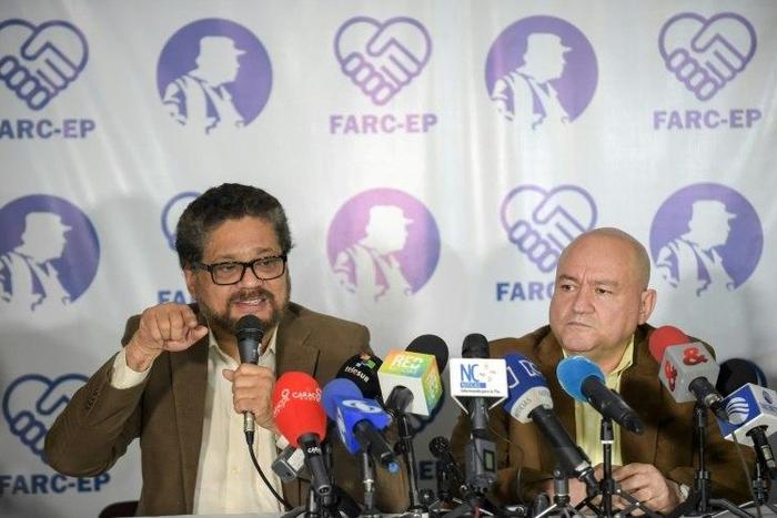 FARC commanders Ivan Marquez (L) and Carlos Lozada deliver a press conference announcing the launching of their political party in Bogota on July 24, 2017.The FARC guerrillas announced Monday they will launch a legal political party on September 1