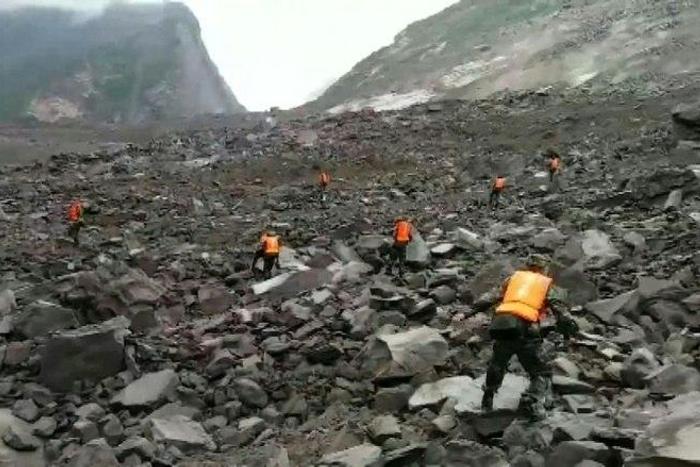 Some 40 homes in the village of Xinmo were swallowed by huge boulders after the side of a mountain collapsed, blocking a two kilometre (one mile) stretch of river