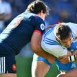 Italy's fly-half Edoardo Padovani (C) fights for the ball with France's center Gael Fickou (R) during their Six Nations rugby union match, at the Olympic Stadium in Rome, on March 11, 2017