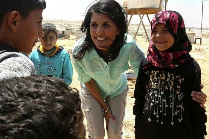 US Ambassador to the UN Nikki Haley talks to Syrian refugees during a visit to the Zaatari refugee camp on the Jordanian border with Syria on May 21, 2017