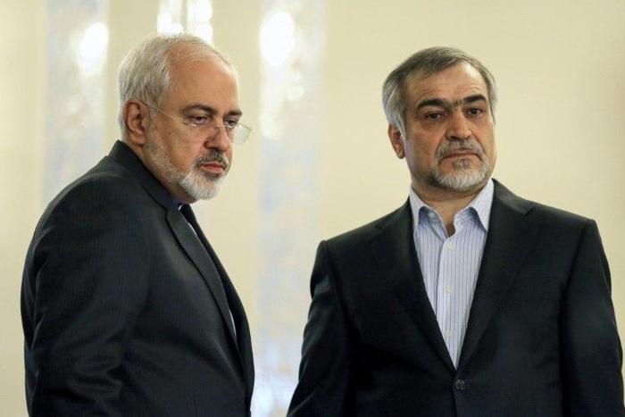 This file photo taken on April 3, 2015 shows Hossein Fereydoun (R) alongside Iranian Foreign Minister Javad Zarif at a news conference in Tehran
