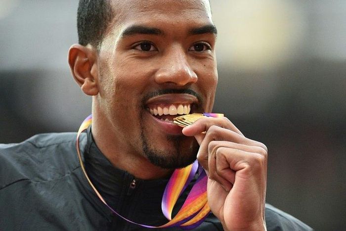 Gold medallist US athlete Christian Taylor poses on the podium during the victory ceremony for the men's triple jump athletics event at the 2017 IAAF World Championships at the London Stadium in London August 11, 2017